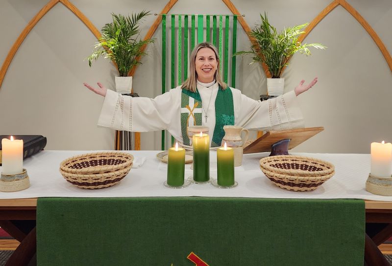 pastor at altar with green paraments