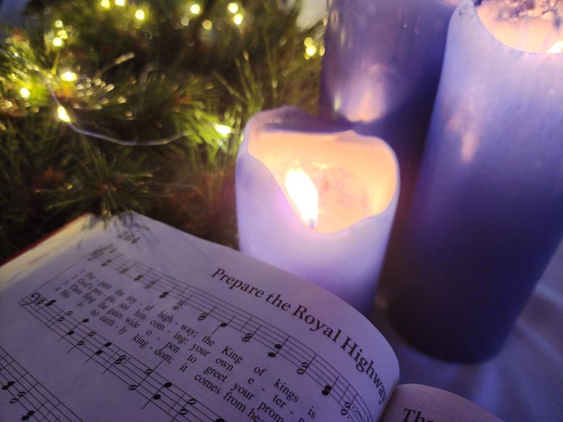 hymnal and candle